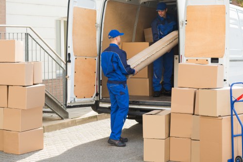 House move planning in Notting Hill with packed boxes and moving van