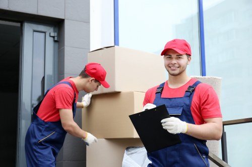 Furniture being carried through a Notting Hill apartment building