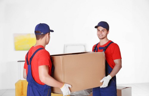 Charity donation boxes and reusable furniture collected during a removal