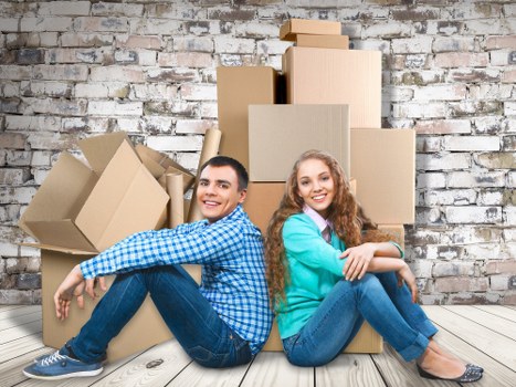 Packed office boxes and furniture ready for a business move