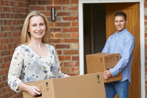 Packed office boxes and furniture ready for relocation in Notting Hill