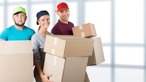 Van loading scene showing secure transport of household goods