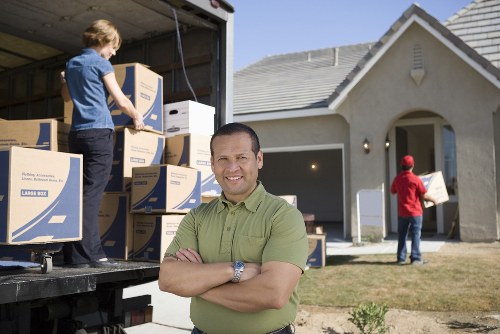 Unpacking household boxes in a Notting Hill flat after delivery