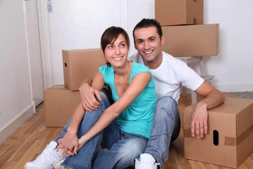 Local movers loading a van near a Notting Hill apartment building