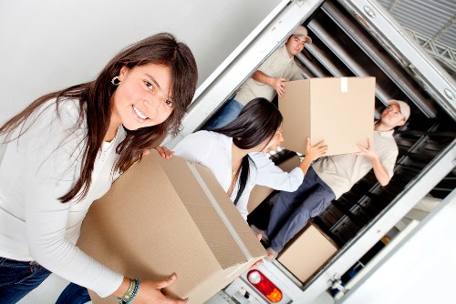 Packed boxes and furniture ready for a house move in Notting Hill